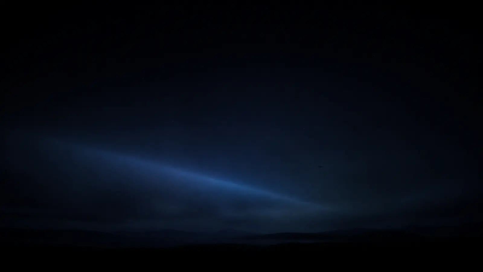 Empty night sky above a low horizon.