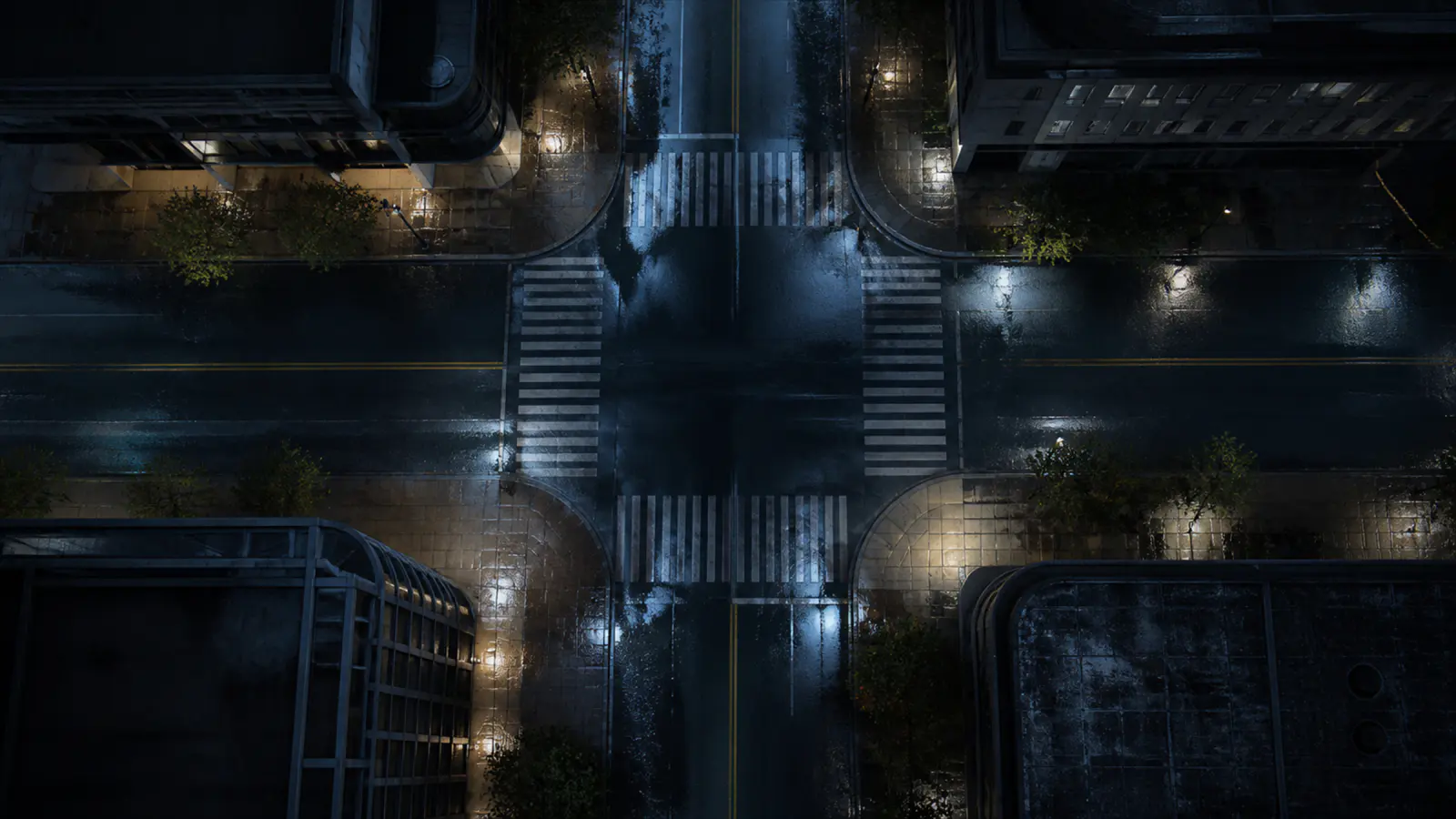 A wet, empty city street from above.