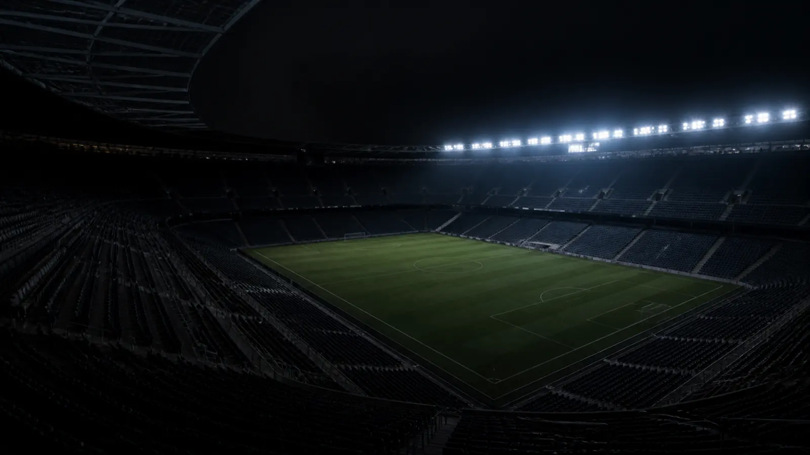 An empty arena bowl at night.